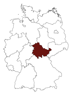 Eine Deutschlandkarte ist an der Stelle des Bundeslandes Thüringen rot gefärbt